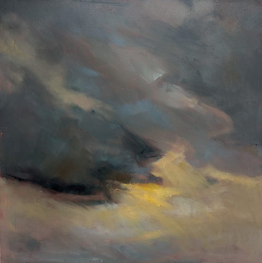 A moment of sunshine breaking through the rain clouds at dusk