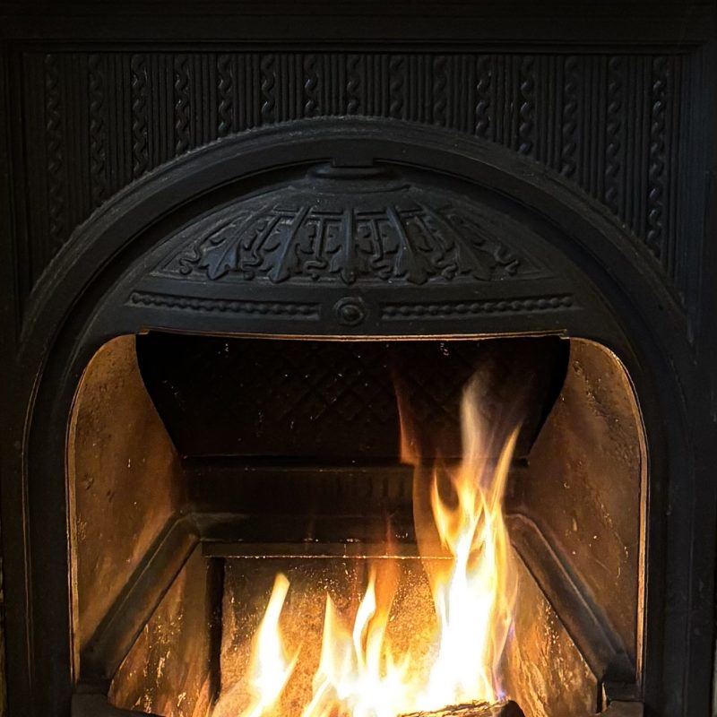 Fireplace with fire burning 