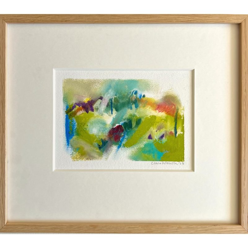 A mixed media abstract landscape framed