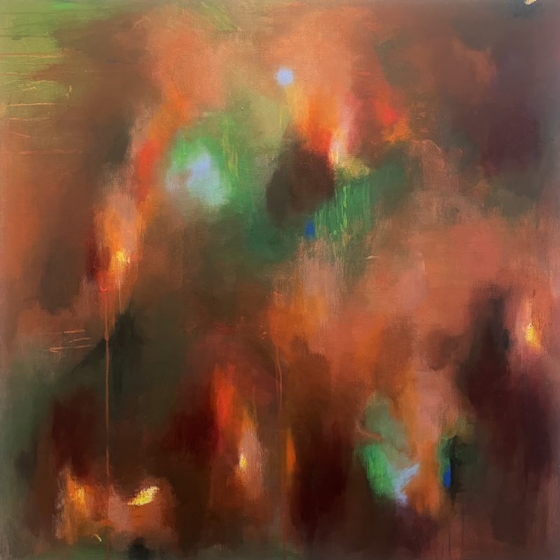 This is a large abstract painting filled with deep, glowing colour. The overall feeling is warm, dense, and atmospheric, like standing inside a dark sunset or watching light flicker through smoke.  The dominant colours are burnt orange, deep red, and dark brown. These tones blend and blur into one another across most of the canvas. There are also areas of green and small touches of bright blue that glow softly through the darker layers. The colours are not sharply defined. They melt into each other, creating a misty, shifting effect.  Near the centre, slightly toward the top, there is a soft circular area of light blue that feels like a distant moon or a small light source. Around it, green spreads outward in a loose halo shape. On the left side and near the bottom, small patches of yellow and orange glow like embers or candlelight.  Thin vertical drips run downward from several bright points, especially on the left and lower centre. These drips look like trails of melted wax or falling rain. They give the painting a sense of gravity and quiet movement, as if light is slowly sinking.  The surface appears layered and soft rather than textured or sharp. There are no clear shapes or figures, but darker vertical forms on the right side suggest shadowy presences or silhouettes. The overall mood feels contemplative and emotional. It carries a sense of warmth mixed with depth and mystery, like memory seen through haze.