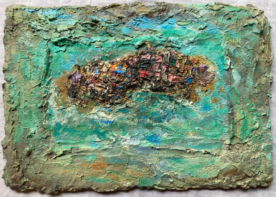 A multicoloured island is built up thickly with paint and plaster surrounded by an aquamarine sea