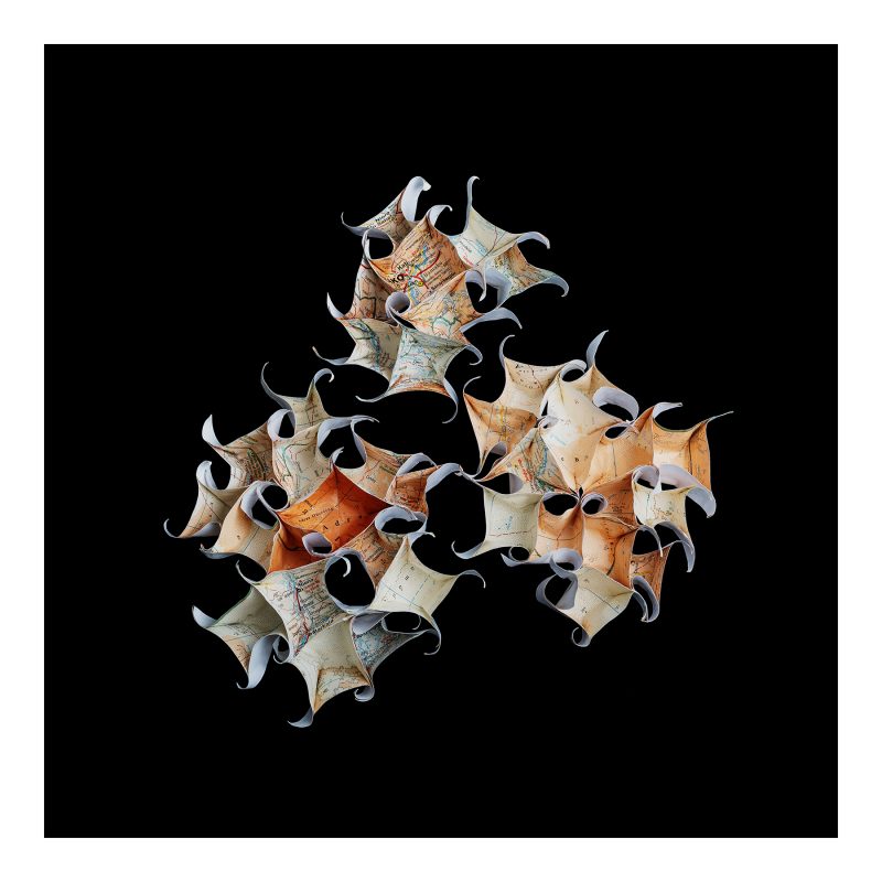 Three spiky shapes created from a map of Mali photographed against a black background.  