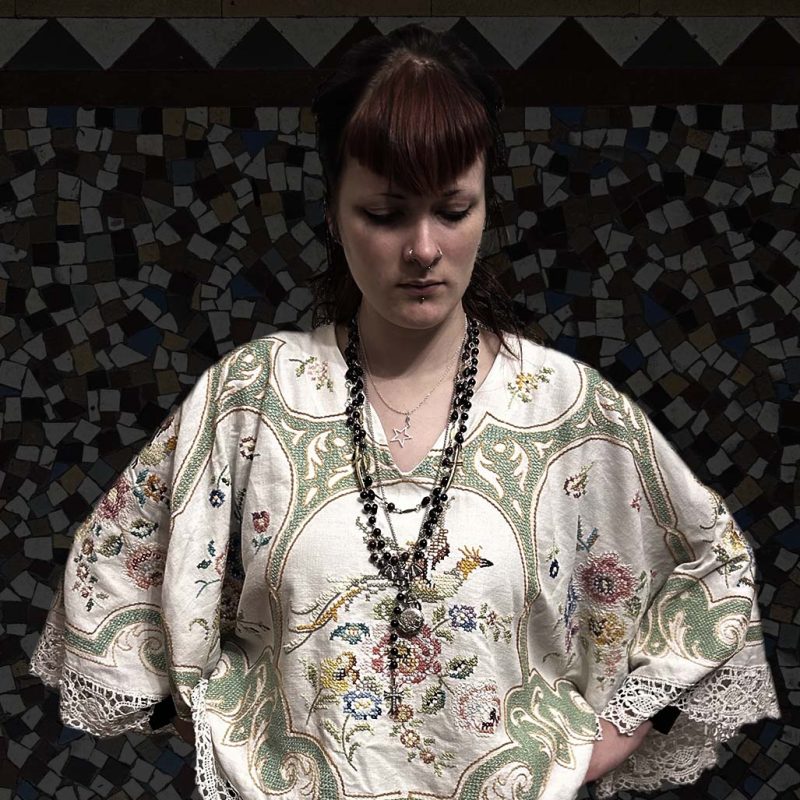 Nina wearing a vintage embroidered top 