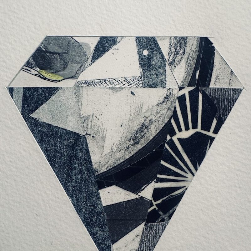 Monochrome faceted diamond print collage with tonal pattern detailing.