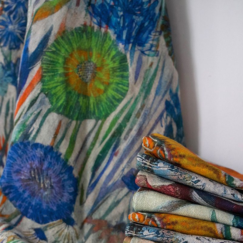 Pile of patterned linen Tea Towels 