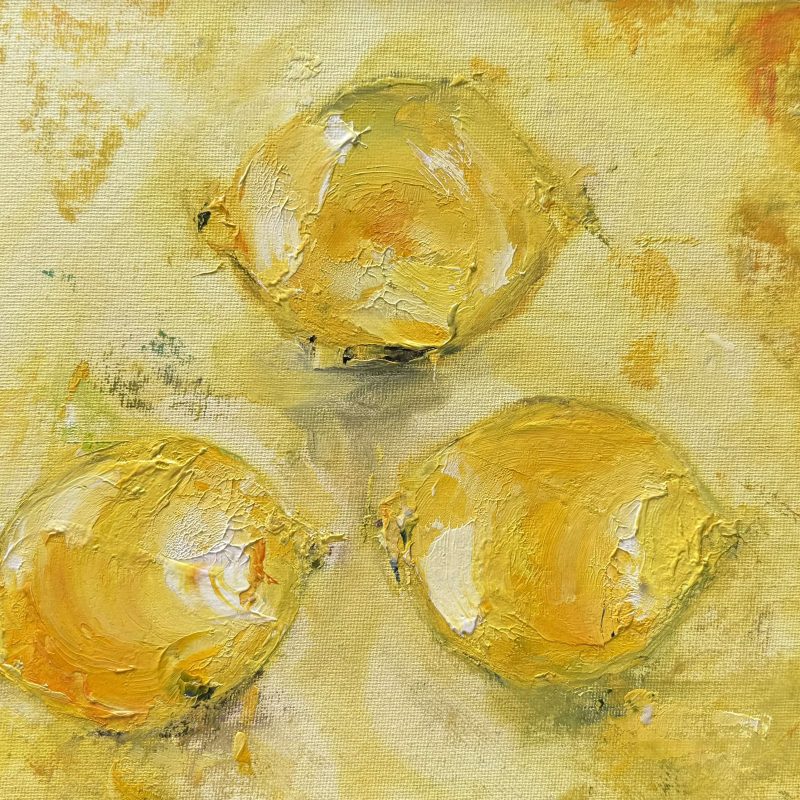 Three lemons on canvas