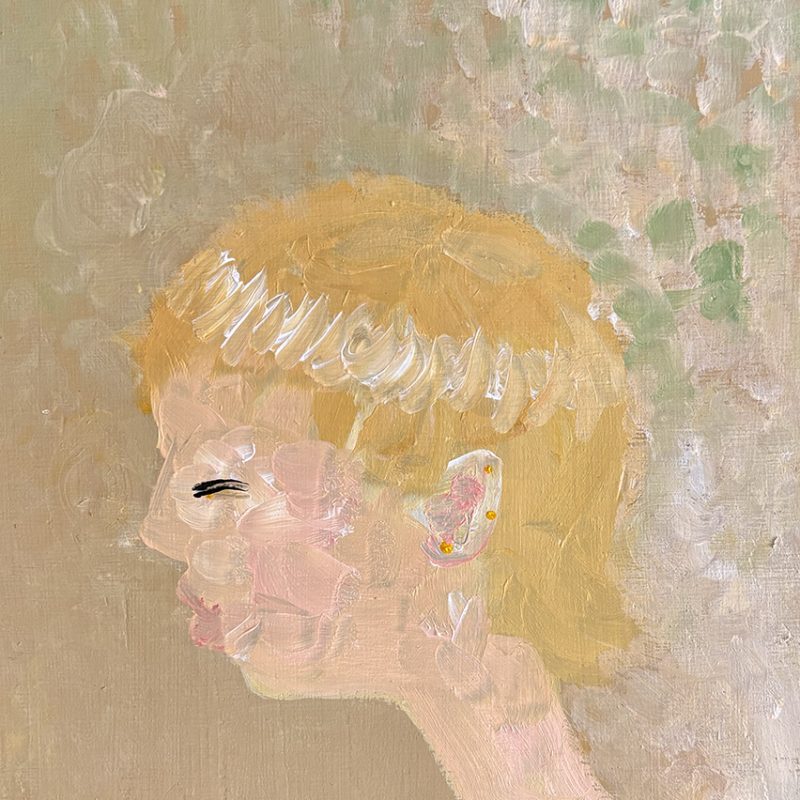 A silhouette of a woman. her eye is closed. muted yellow and red colours