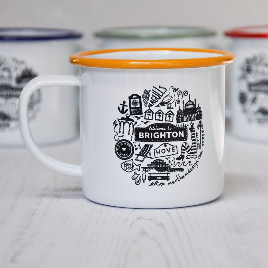 White enamel mug with a yellow rim. Etched with a black illustration in a circular design of Brighton and Hove illustrations. 
