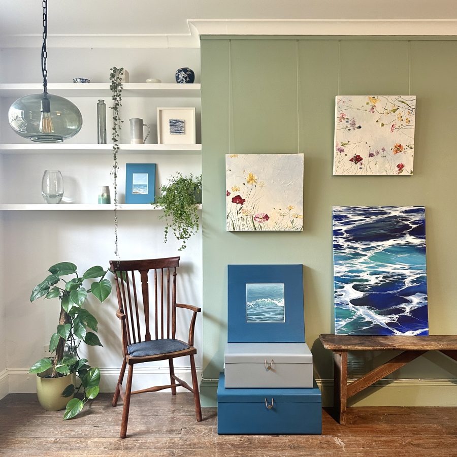 Paintings of the sea and flowers and countryside, in a house full of light and plants