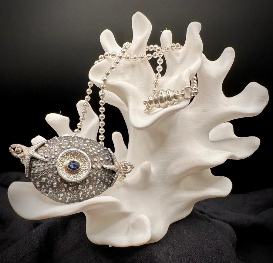 Sterling silver sea urchin, sapphire set in 18 ct gold 