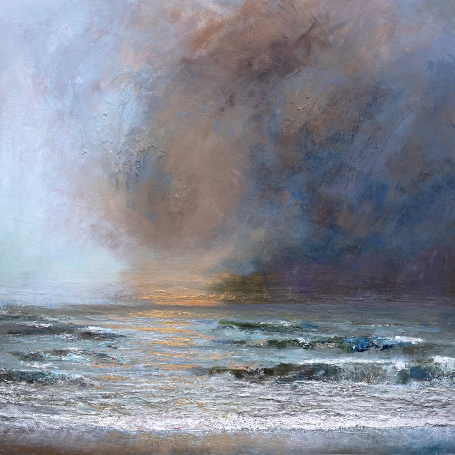 Bold and moody seascape with bronze and gold sky and golden light on waves