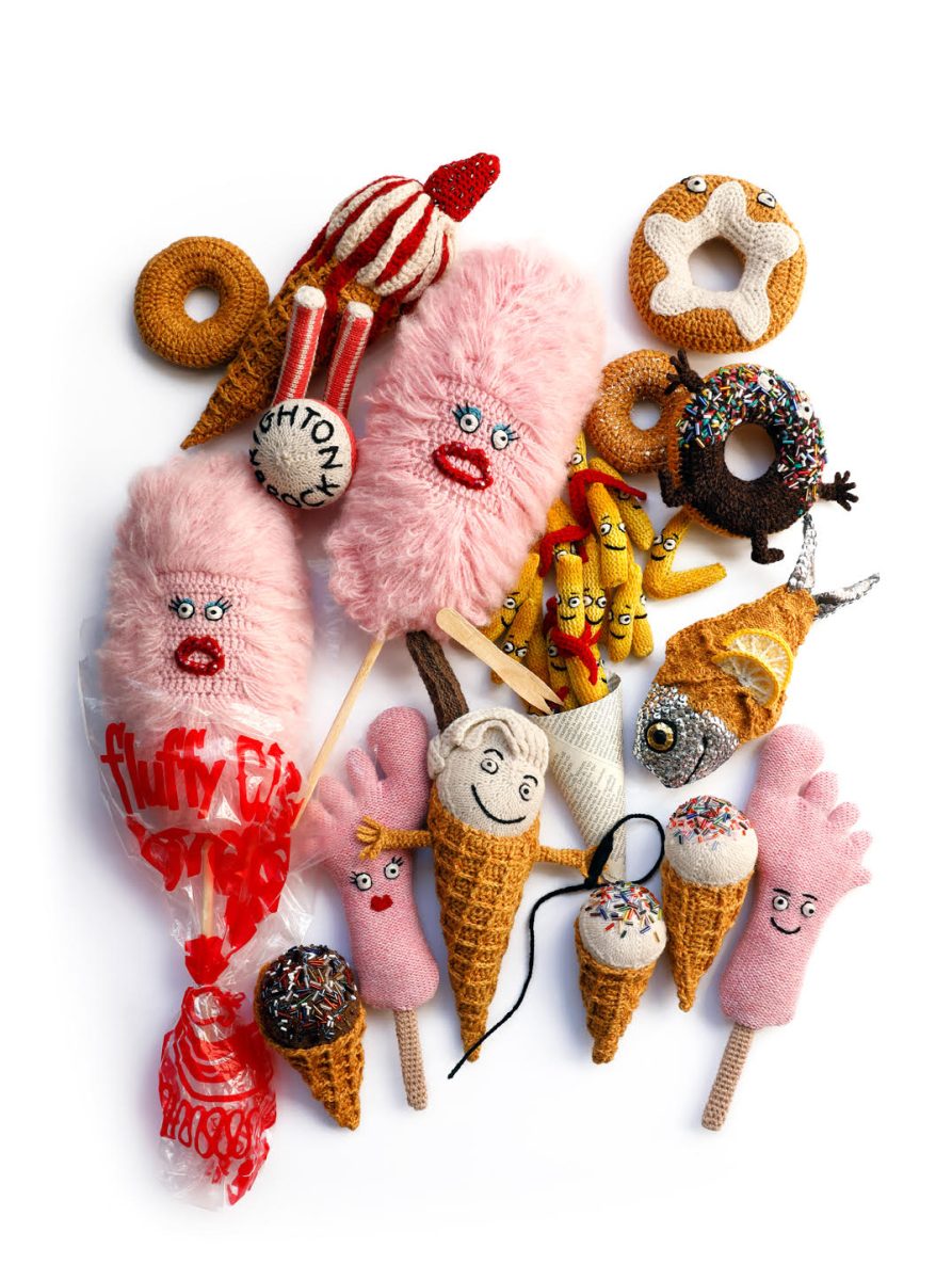 A selection of typical seaside foods including ice-creams, candy floss, fish and chips and donuts. 