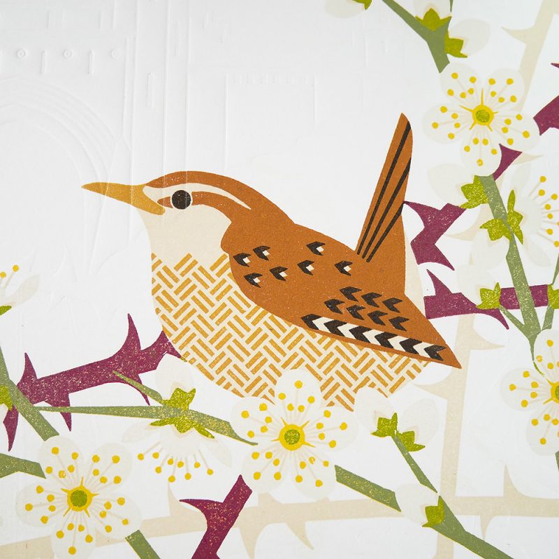 Wren with decorative emobossed background, made using lino cut print