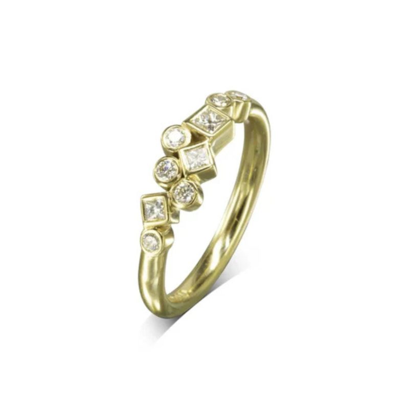  a mix of round brilliant cut and princess cut diamonds, ranging in size from 1.5mm to 3mm set in gold settings in a scattered arrangement on a plain gold band