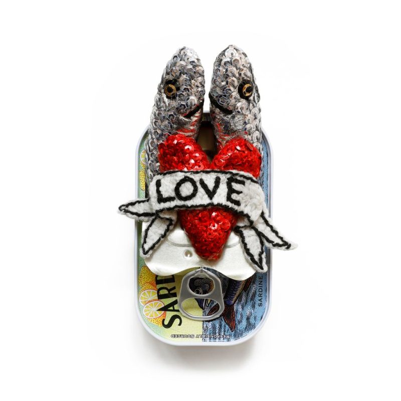 2 knitted, hand sequinned sardines presented in a recycled tin.