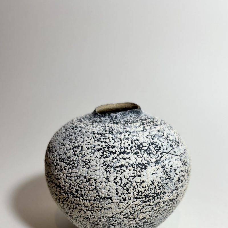 Wheel thrown jar black and white slip