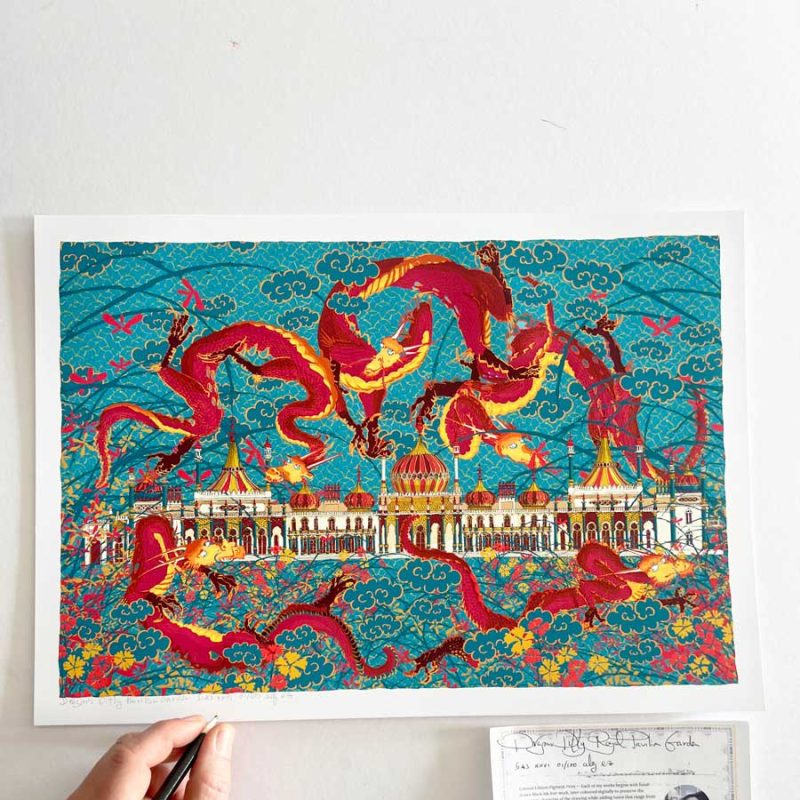 Dragons Ditty – Royal Pavilion Garden The Royal Pavilion rises from gardens of jasmine and sweet william, while dragons weave, fly, and mingle among the flowers. The sky above becomes a patterned field—Japanese-inspired clouds, blossoming trees, and geometric motifs merging with nature. This print nods to two of my favourite artists: Hokusai, for his natural motifs and compositional approach, and Chen Rong, whose Nine Dragons handscroll I saw at the V&A in 2013. I built the image from separate ink drawings, each like a plate, layered into a single design. The Pavilion itself is John Nash’s 1815 Indo-Saracenic creation—domes, towers, and minarets painted to look like Bath stone.