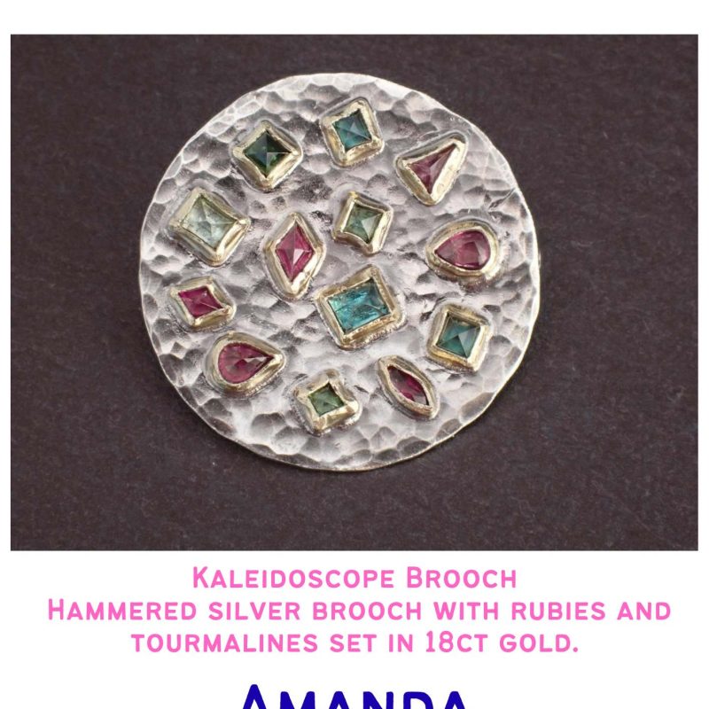 Hammered silver brooch with rubies and tormalines set in 18ct gold.