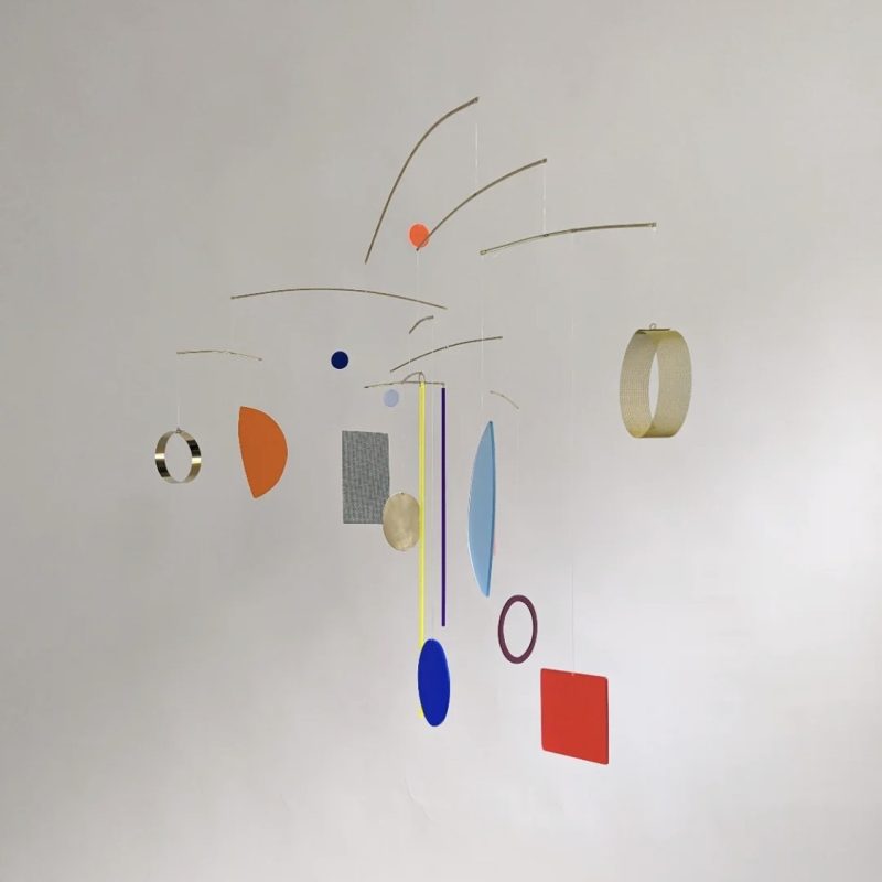 Coloured Acrylic Shapes on Brass Rods and Nylon String Hanging Structure against a white background.