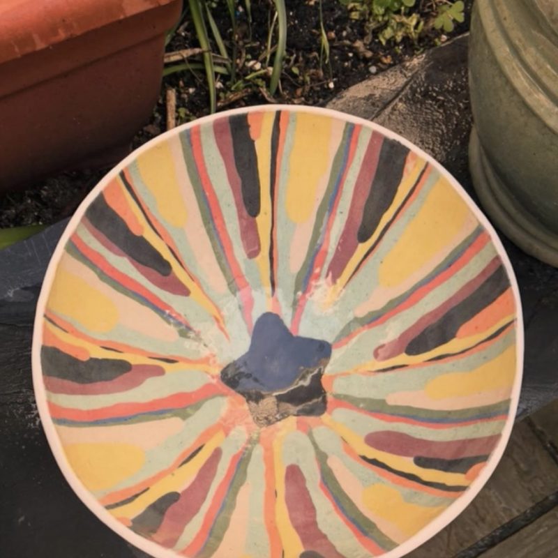 Colourful striped bowl for garden orange and browns 