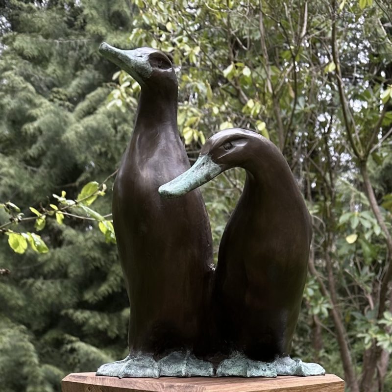 Two ducks together in metal 