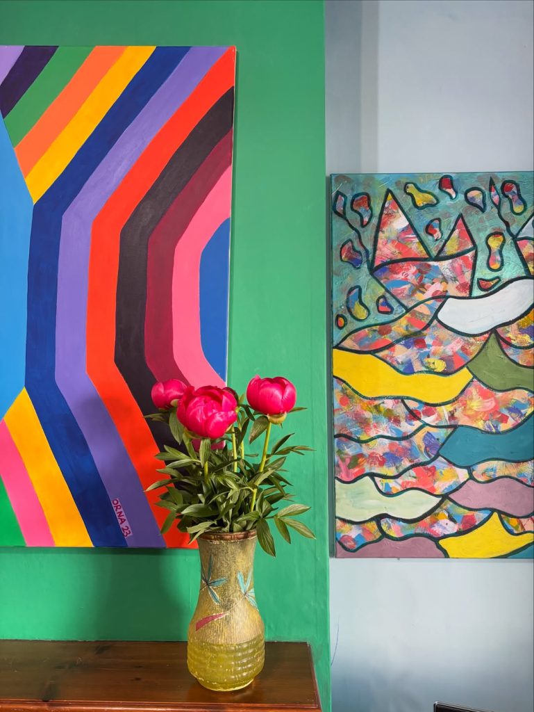 Image of artwork a vase and 2 paintings